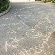 Kopernik essential worker support: chalk art filling the driveway